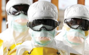 • Health care workers leaving a high-risk area at the Medecins Sans Frontieres’ Elwa Hospital in Monrovia, Liberia