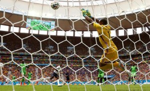 Nigeria goalkeeper Vincent Enyeama saves a shot by Paul Pogba of France. 