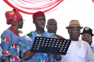 Senator Ifeanyi Okowa flanked by his wife and Professor Sam Oyobvbaire during his governorship declaration in Asaba, Delta State.