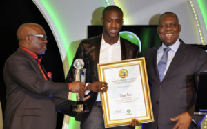 L-R: Delta State Governor, Emmanuel Uduaghan; African Footballer of the year, Yaya Toure; and CAF President, Issa Hayatou, during the 2014 Glo/CAF Award in Lagos