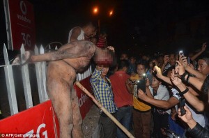 Lynched: The gang overpowered security at the Central Jail in the city of Dimapur and grabbed the man before beating him to death. It is unclear whether he is dead in this shocking image