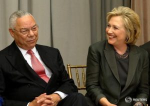 Former U.S. Secretaries of State Colin Powell (L) and Hillary Clinton (R) listen to remarks at a groundbreaking ceremony for the U.S. Diplomacy Center at the State Department in Washington September 3, 2014. REUTERS/Jonathan Ernst/File Photo
